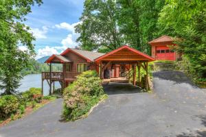 a large red house with a walk way to it at Armstrong House Combo in Lake Junaluska