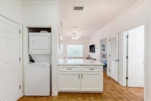 a white kitchen with a sink and a dishwasher at Dauphin Island Beach Club 210B in Dauphin Island