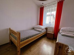 Postel nebo postele na pokoji v ubytování Ośrodek wypoczynkowy Niesulice 2