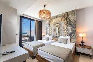 Postel nebo postele na pokoji v ubytování Babana Hotel