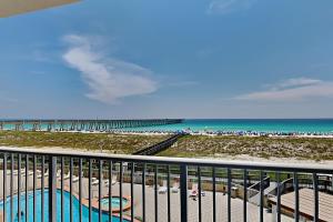 a view of the beach from the balcony of a condo at Summerwinds #204 in Navarre