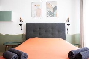 Llit o llits en una habitació de Studio cosy en plein cœur historique de Pontoise