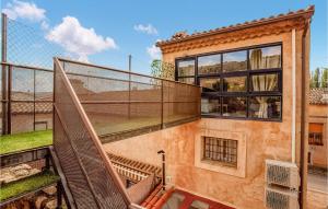 an outdoor balcony of a house with a fence at 2 Bedroom Nice Home In Imon in Imón