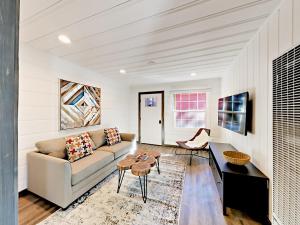 a living room with a couch and a table at Manzanita Holiday in South Lake Tahoe