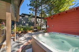 a hot tub in the backyard of a house at Manzanita Holiday in South Lake Tahoe