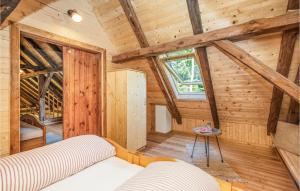 a bedroom with a bed in a wooden cabin at Kellerstoeckl In Strem in Strem