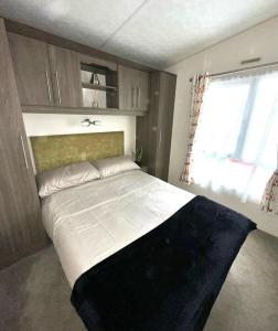 a bedroom with a large bed in a room at The Rannoch Len 1 in Forfar