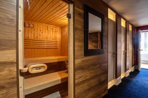 a sauna with wooden walls and a wooden door at Finest Retreats - Apley Hall in Bridgnorth