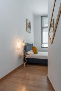 En eller flere senge i et værelse på tuGuest Postigo II Catedral Apartment - Free parking