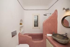 a bathroom with a wooden sink and a toilet at Villa Joy in Fanari +34 photos