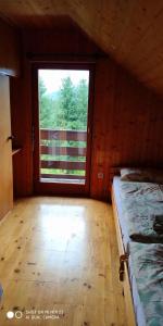 Postel nebo postele na pokoji v ubytování Holiday House Jezerka