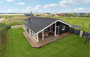 an overhead view of a black house with a deck at Lovely Home In Storvorde With Sauna in Egense