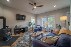 a living room with a couch and a fireplace at Walk to Helen Downtown-Gated Golf Resort in Helen