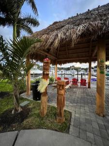 a wooden pergola with a table and chairs at Marina Vibes - Sarasota in Sarasota