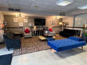 a living room with couches and a flat screen tv at Marina Vibes - Sarasota in Sarasota