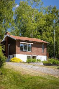 a small brick house in the middle of a field at Rydetvägen, peaceful, fresh 8 bedrooms near Gothenburg City in Gothenburg