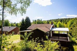 a house with a porch and a roof at Rydetvägen, peaceful, fresh 8 bedrooms near Gothenburg City in Gothenburg