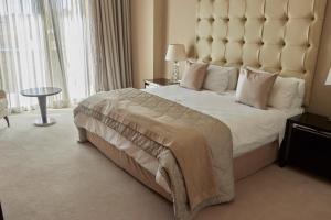 En eller flere senge i et værelse på Mseleku Villa