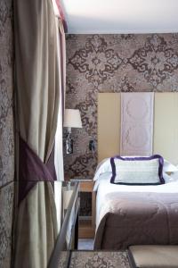 Łóżko lub łóżka w pokoju w obiekcie Splendid Venice - Starhotels Collezione