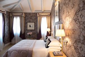 Łóżko lub łóżka w pokoju w obiekcie Splendid Venice - Starhotels Collezione