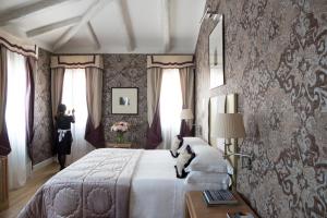 Łóżko lub łóżka w pokoju w obiekcie Splendid Venice - Starhotels Collezione
