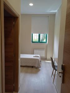 Posteľ alebo postele v izbe v ubytovaní Casa Diocesana VIA LUCIS