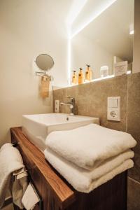 Phòng tắm tại Hotel MeerZeiten inklusive externer Schwimmbad- & Saunanutzung
