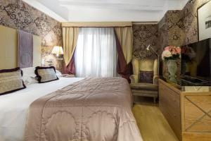 Łóżko lub łóżka w pokoju w obiekcie Splendid Venice - Starhotels Collezione