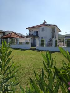 a view of the house from the yard at Krapce - Lake View Apartments in Star Dojran