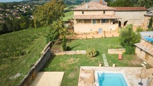an aerial view of a house with a swimming pool at LE CLOS ZÉLIE in Pouilly-le-Monial