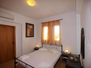 Postel nebo postele na pokoji v ubytování villa Nefeli + 25 fotografií