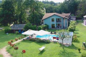 an aerial view of a house with a swimming pool at Vila Ljubica in Vrnjačka Banja