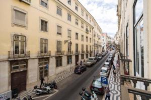 a view of a street with parked cars and buildings at Ola Lisbon - Chiado 1 in Lisbon