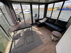 a living room with a view of the water at Ringö Resort in Gothenburg