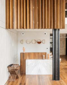 a dining room with a table and two chairs at New Hotel Le Quai - Vieux Port in Marseille