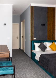 Un pat sau paturi într-o cameră la BG Palace Hotel