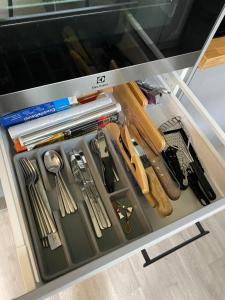 a drawer filled with lots of different types of tools at Oja 134 Apartments in Pärnu