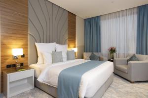 Postel nebo postele na pokoji v ubytování Cantonal Hotel by Warwick
