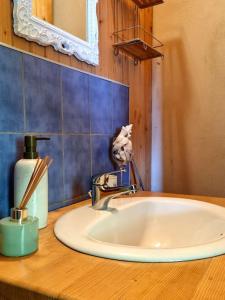 a bathroom counter with a sink and a mirror at Apartmán RN in Banská Štiavnica