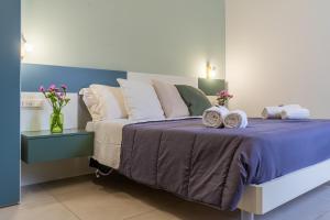 Postel nebo postele na pokoji v ubytování B&B Domus Magma