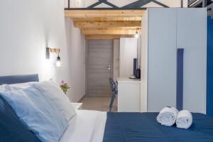 Postel nebo postele na pokoji v ubytování B&B Domus Magma