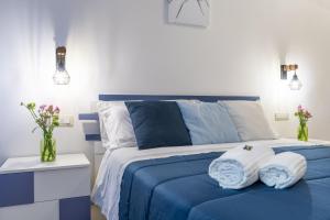 Postel nebo postele na pokoji v ubytování B&B Domus Magma