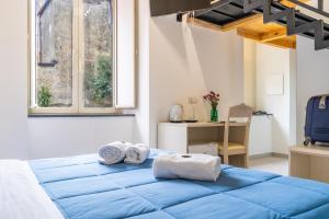 Postel nebo postele na pokoji v ubytování B&B Domus Magma
