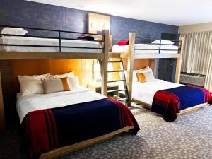 a room with two bunk beds and a ladder at Riverhouse on the Deschutes in Bend