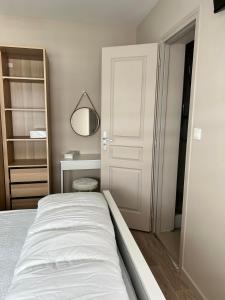 Voodi või voodid majutusasutuse Appartement RDC à 2 pas de la Plage et des commerces de BERCK PLAGE toas