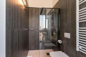 a bathroom with a shower and a toilet at HTM Venice Suite in Mestre