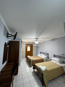 Postel nebo postele na pokoji v ubytování Nikos Studios and Apartments