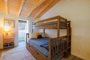 a bedroom with two bunk beds in a room at Top Floor Condo w/ Ocean Views [Admirals Quarters] in Southwest Harbor