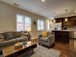 a living room with a couch and a table at Bright 2BR near downtown in Cincinnati