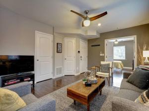 a living room with a couch and a table at Bright 2BR near downtown in Cincinnati